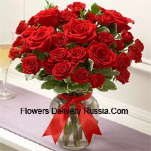 37 Red Roses With Some Ferns In A Glass Vase
