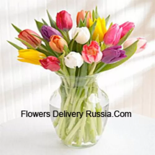Mixed Colored Tulips In A Glass Vase - Please Note That In Case Of Non-Availability Of Certain Seasonal Flowers The Same Will Be Substituted With Other Flowers Of Same Value