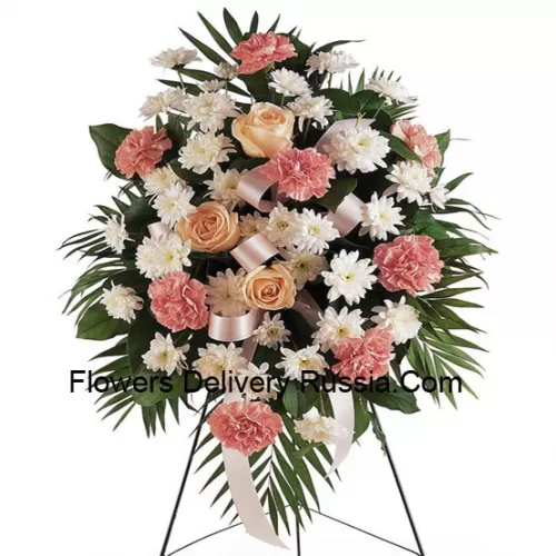 Un bel arrangement floral de condoléances qui vient avec un support