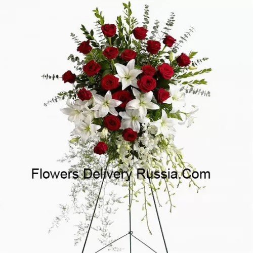 Un bel arrangement floral de sympathie avec un support