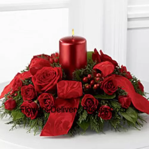 A crimson display of holiday warmth and cheer. Rich red roses and spray roses, red hypericum berries and lush holiday greens encircle a red metallic pillar candle to create a heart-warming centerpiece. Bedecked with bright red ribbon, this design will bring the spirit of the holiday season to their gatherings and celebrations with style and grace.  (Please Note That We Reserve The Right To Substitute Any Product With A Suitable Product Of Equal Value In Case Of Non-Availability Of A Certain Product)